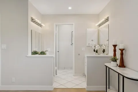a bathroom with a sink a mirror and shower