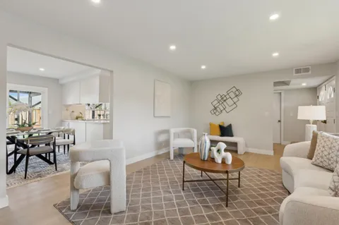 a living room with furniture and a table