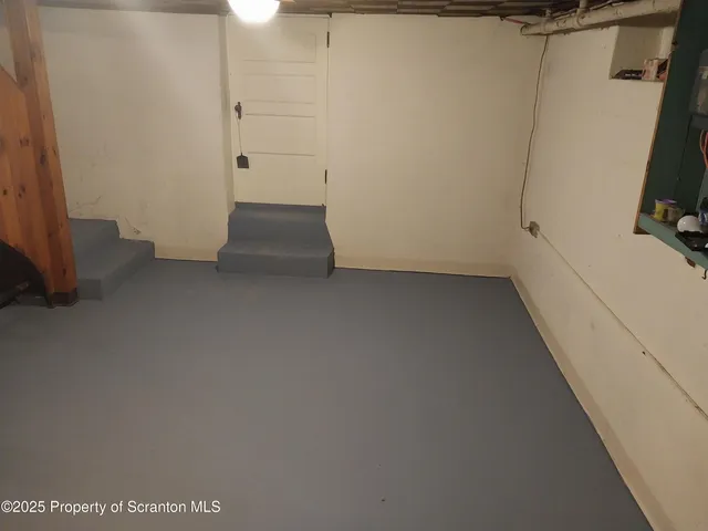 a view of walk in closet with clothes