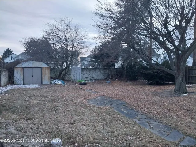 a room with wooden floor and furniture