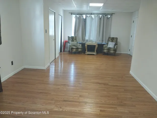 a kitchen with a refrigerator and cabinets