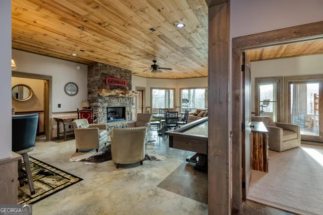 a view of a dining room with furniture a chandelier and chandelier