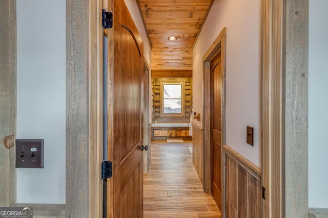 a bathroom with a toilet a sink and a window