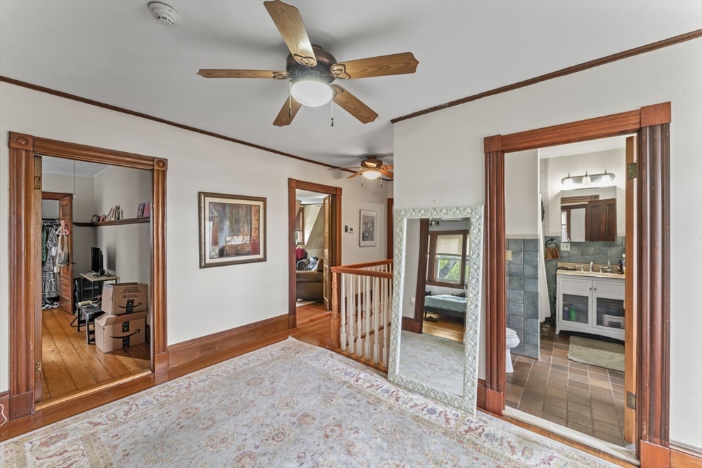 388 Arborway Boston, MA 02130 - Photo 18 of 29 a view of livingroom with hardwood floor and a ceiling fan