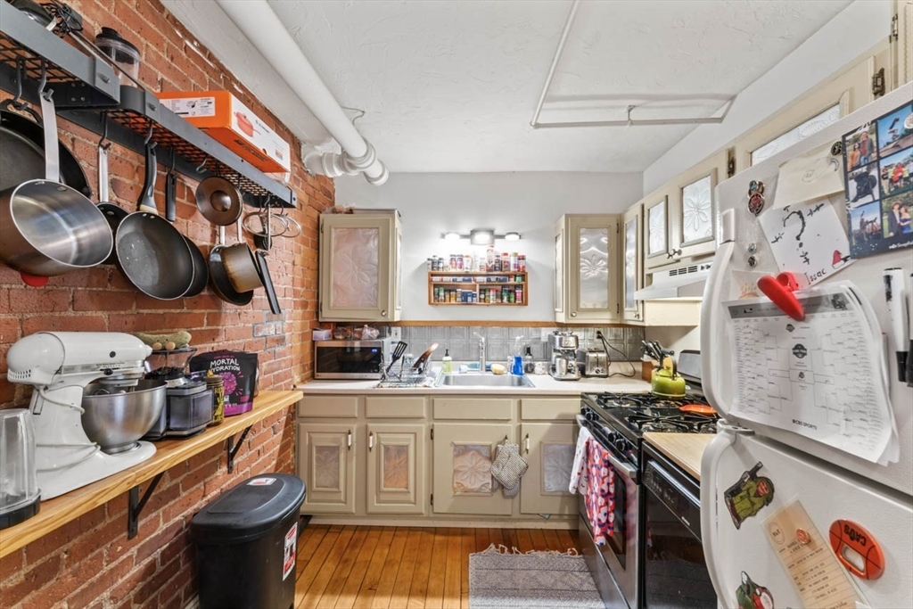 388 Arborway Boston, MA 02130 - Photo 21 of 29 a storage room with cabinets