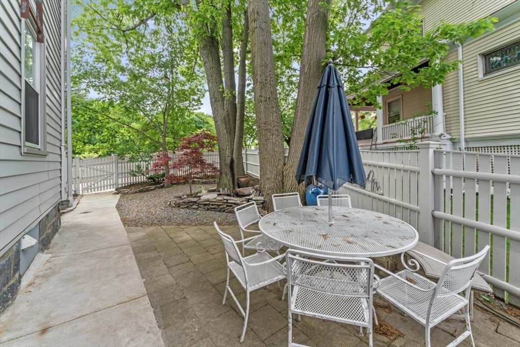 388 Arborway Boston, MA 02130 - Photo 23 of 29 a view of a patio with a table and chairs