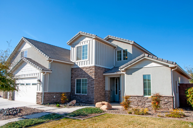 429 East Treasure Road Washington, UT 84780 - Photo 1 of 20 Contemporary exterior featuring stacked stone accents, stucco siding, and vertical board-and-batten siding