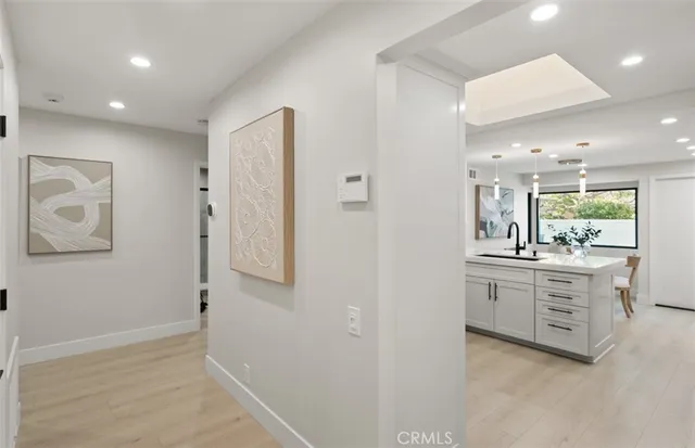 a bathroom with a granite countertop sink mirror and a toilet