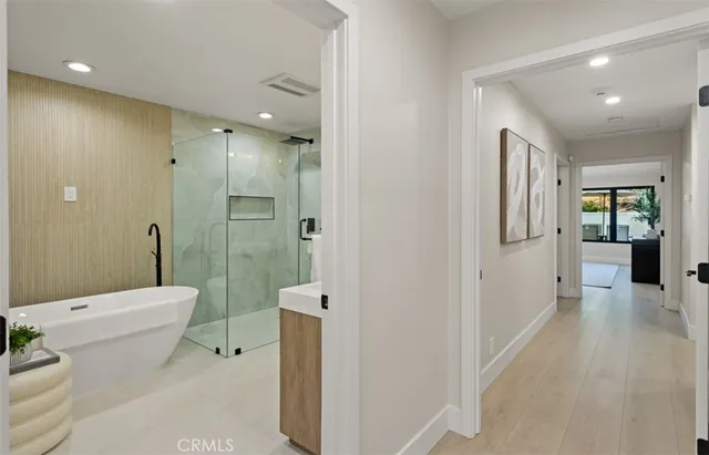 a bathroom with a toilet sink and shower