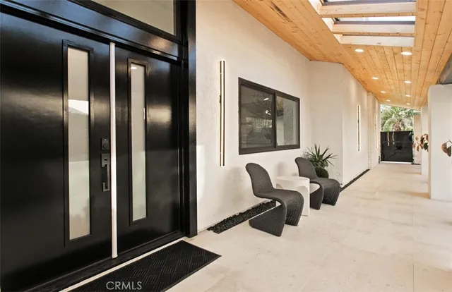 a view of a hallway with seating area