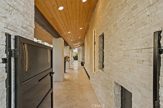 a hallway with sliding door and main door