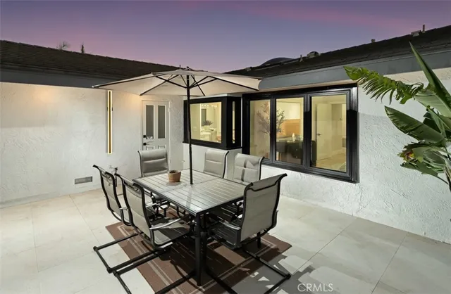 a patio with table and chairs