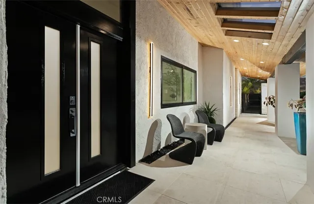 a lobby with furniture and a rug