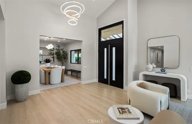 a living room with furniture and a mirror