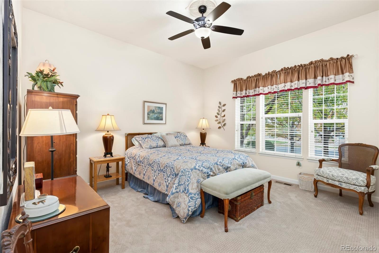 4945 Bierstadt Loop Broomfield, CO 80023 - Photo 16 of 33 a spacious bedroom with a bed and a window