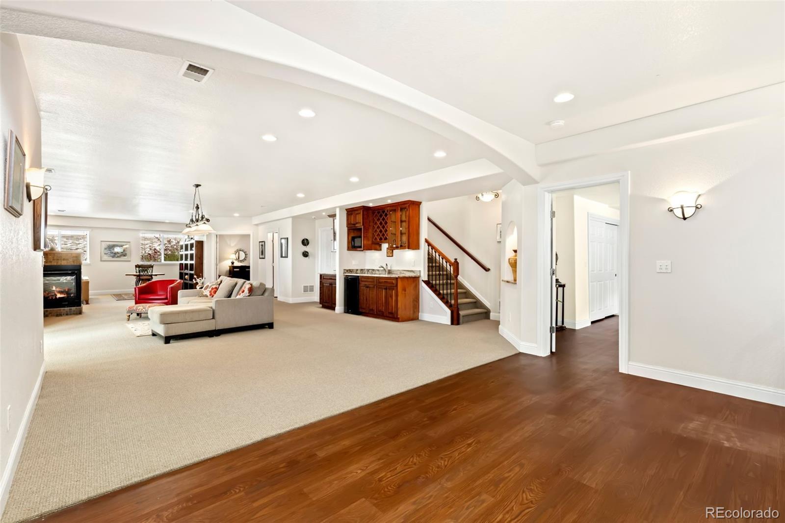 4945 Bierstadt Loop Broomfield, CO 80023 - Photo 22 of 33 a living room with furniture and a large window