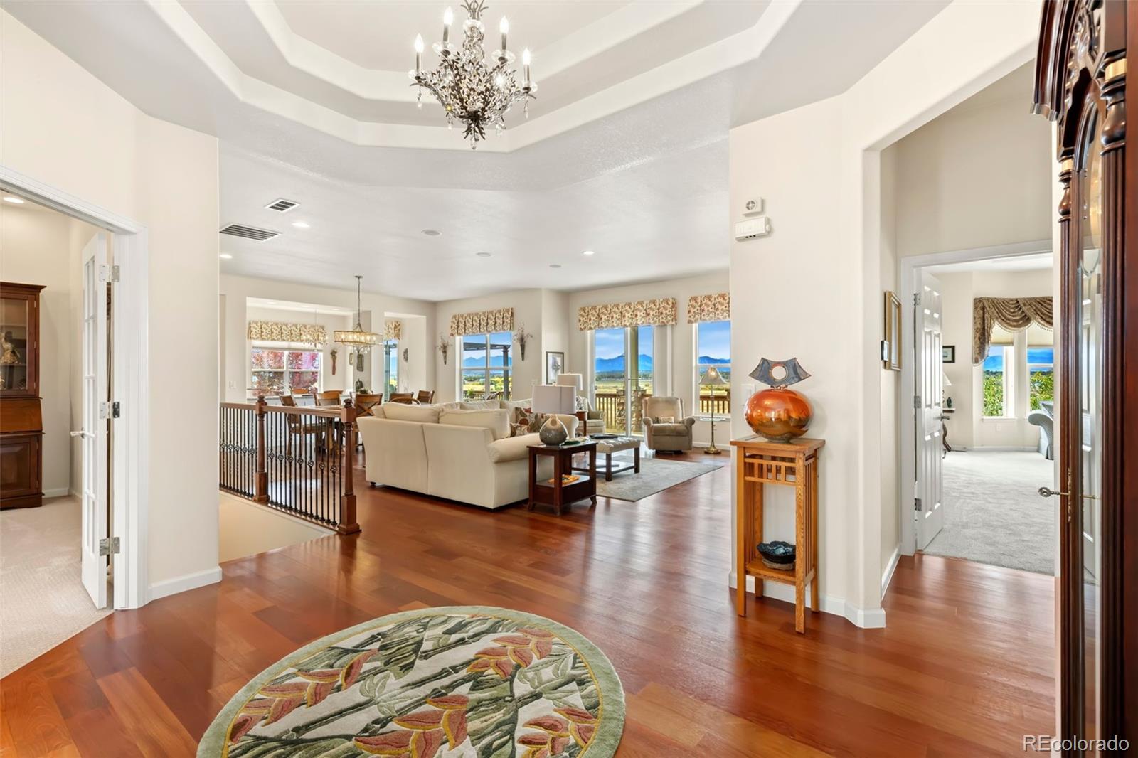 4945 Bierstadt Loop Broomfield, CO 80023 - Photo 4 of 33 a living room with furniture and a wooden floor