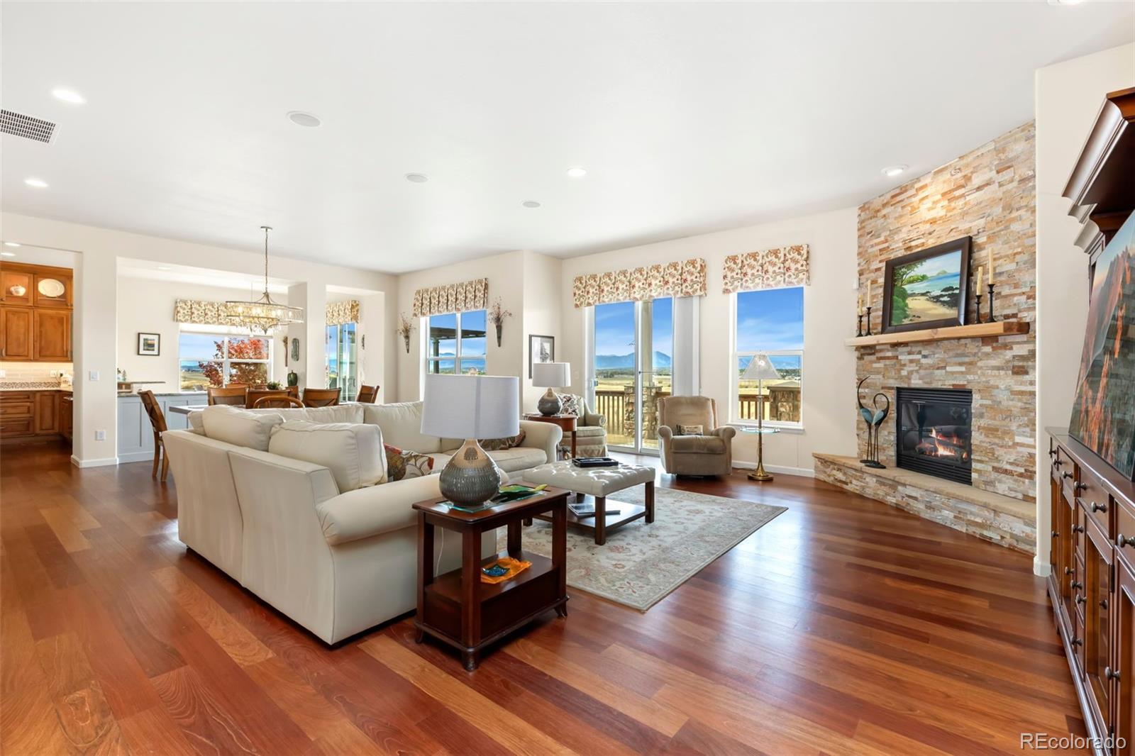 4945 Bierstadt Loop Broomfield, CO 80023 - Photo 5 of 33 a living room with furniture and a fireplace
