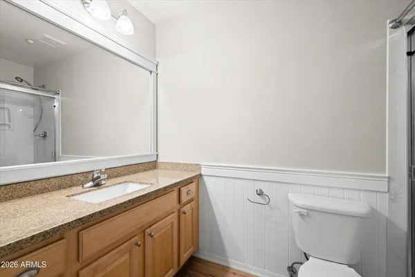 a bathroom with a glass shower door