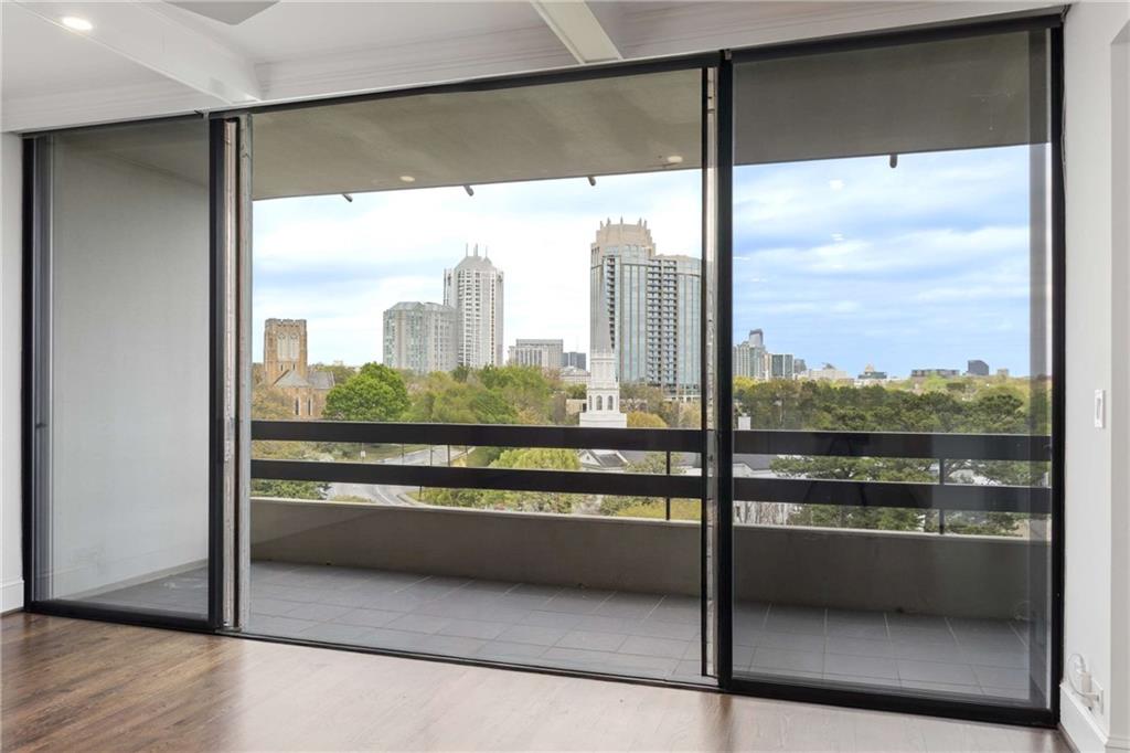 2660 Peachtree Road Northwest, Unit 13F Atlanta, GA 30305 - Photo 11 of 56 a view of a glass door with a glass door