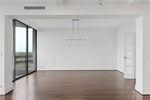 a bathroom with a granite countertop double vanity sink and a mirror