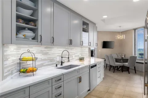 a view of a kitchen with appliances and a sink