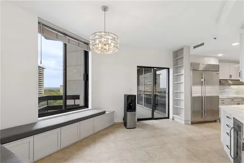 a view of building with yard and trees in the background