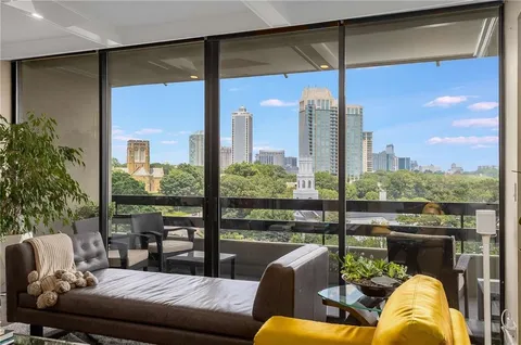 a living room with furniture city view