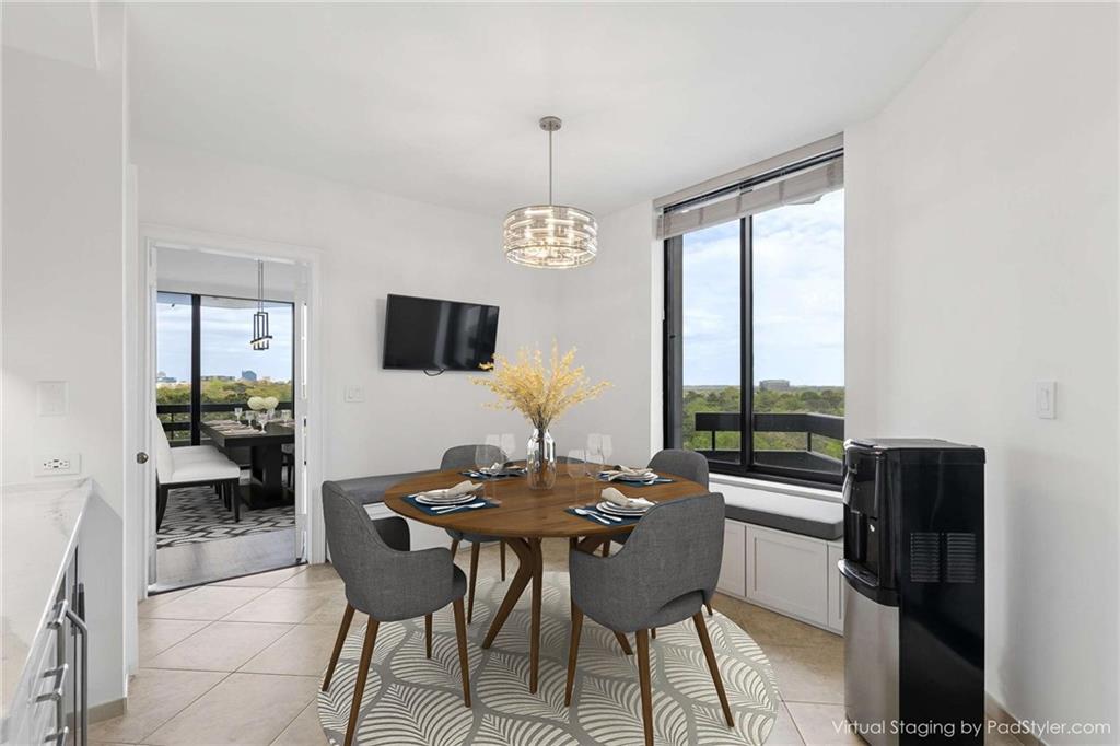 2660 Peachtree Road Northwest, Unit 13F Atlanta, GA 30305 - Photo 7 of 56 a dining room with furniture a chandelier and wooden floor