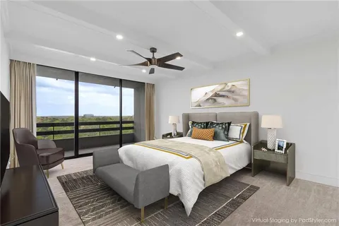 a large bathroom with a glass door shower and sink