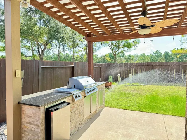 a patio with water table and chairs