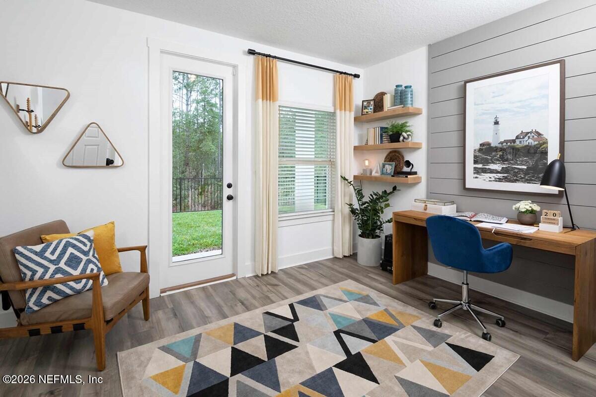 9925 Element Road Jacksonville, FL 32256 - Photo 5 of 7 a living room with furniture and a window
