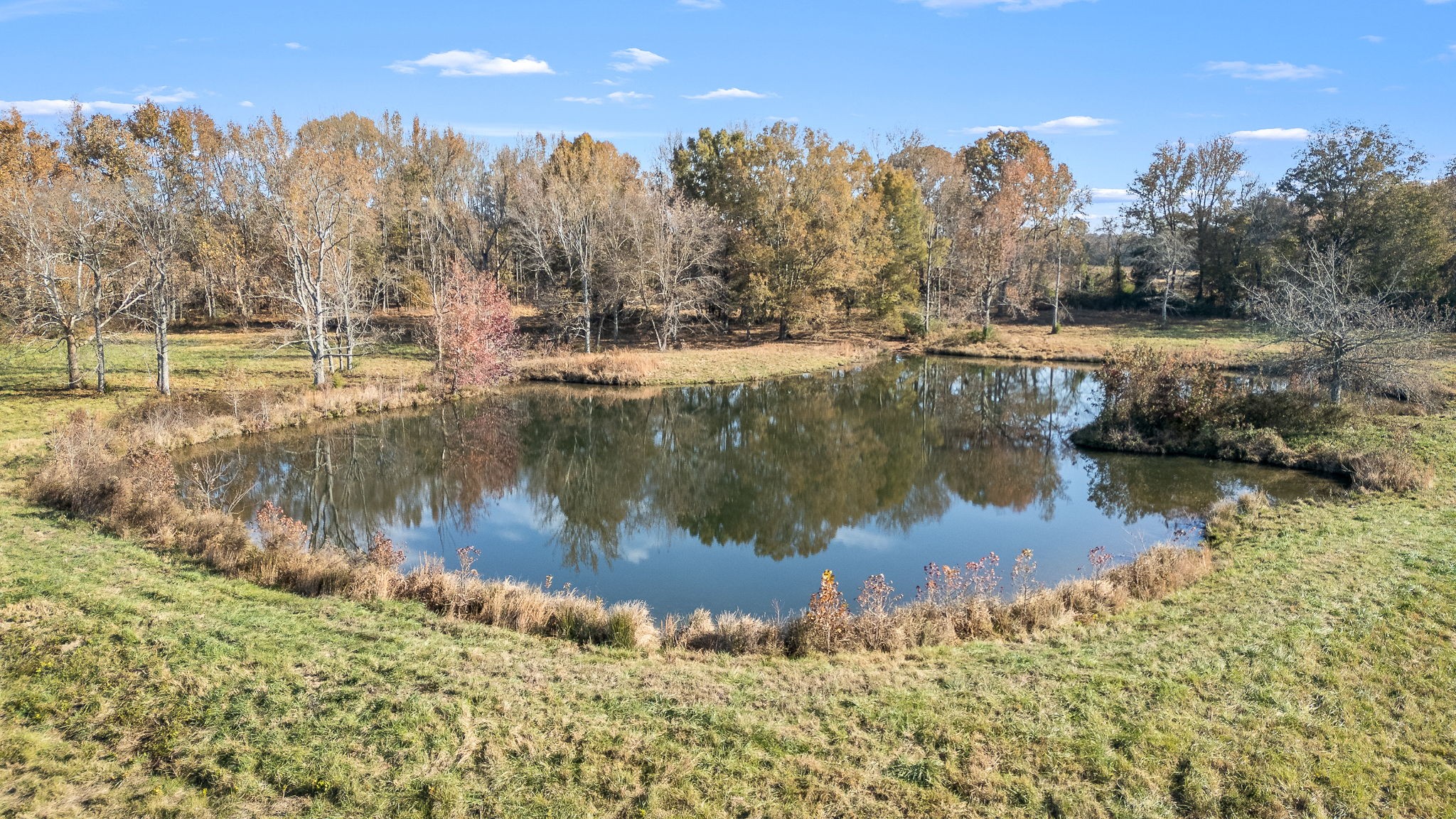 240 Vanntown Road Flintville, TN 37335 - Photo 14 of 23 a view of a lake with a yard and mountain view