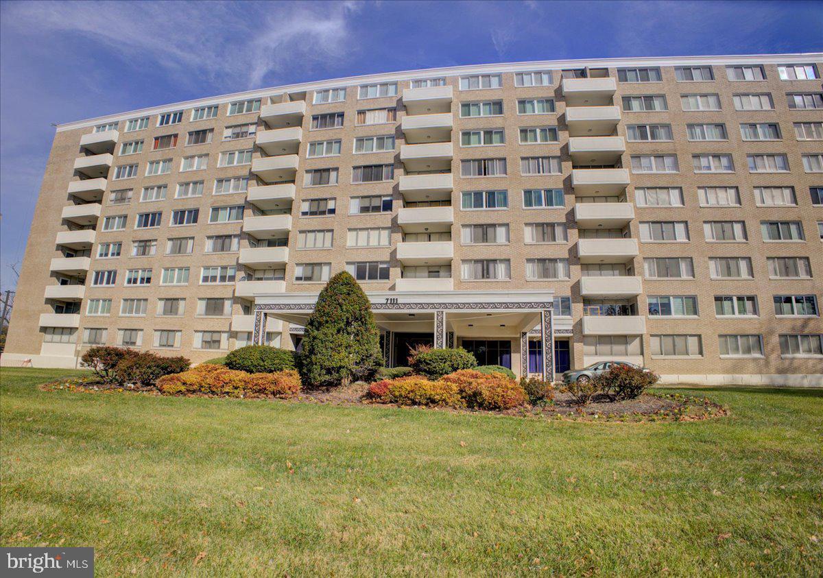 a front view of a building with garden
