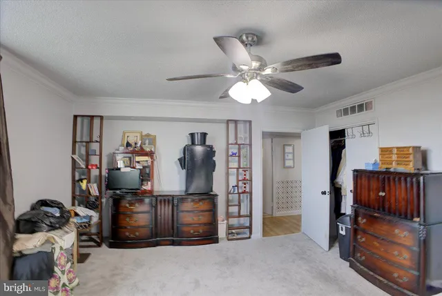 a view of a workspace with furniture and closet