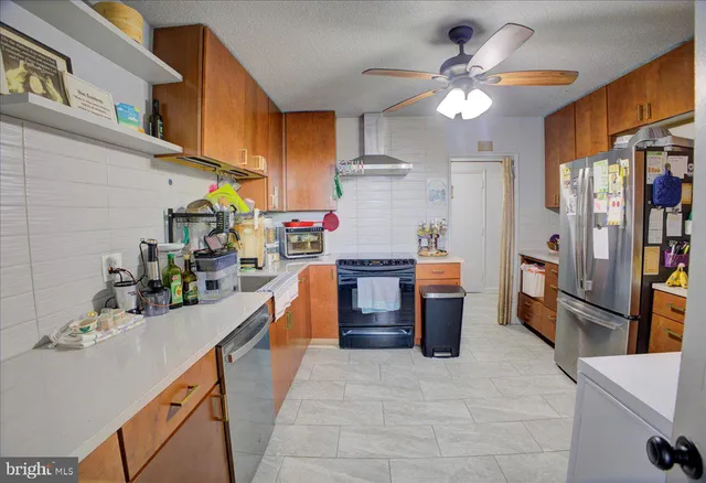 a kitchen with a sink appliances and cabinets