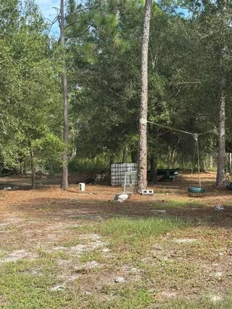 a view of a yard with a house