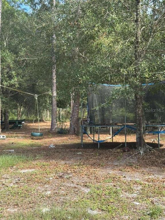 415 North Verda Street Clewiston, FL 33440 - Photo 2 of 7 a view of a park with swings