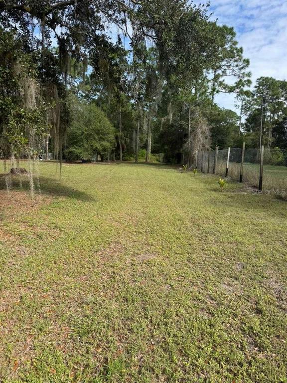 415 North Verda Street Clewiston, FL 33440 - Photo 4 of 7 a view of a yard with a tree