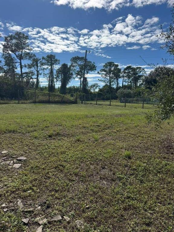 415 North Verda Street Clewiston, FL 33440 - Photo 5 of 7 a view of a building with a yard