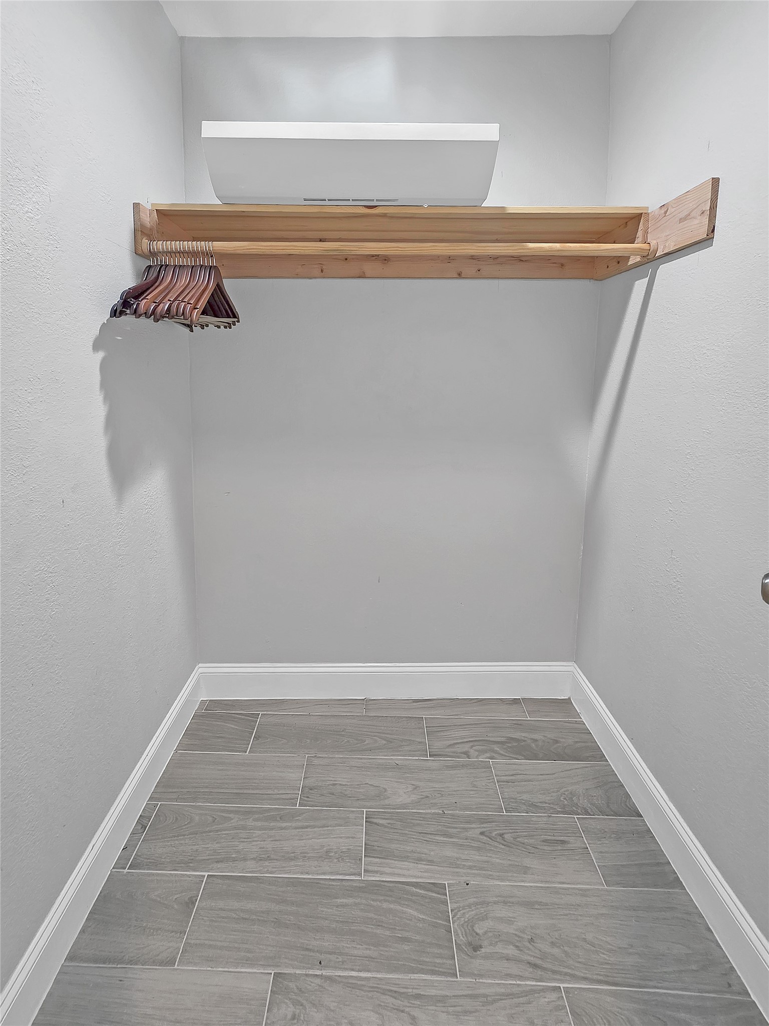7013 Hemlock Street Houston, TX 77087 - Photo 5 of 8 a view of walk in closet with clothes
