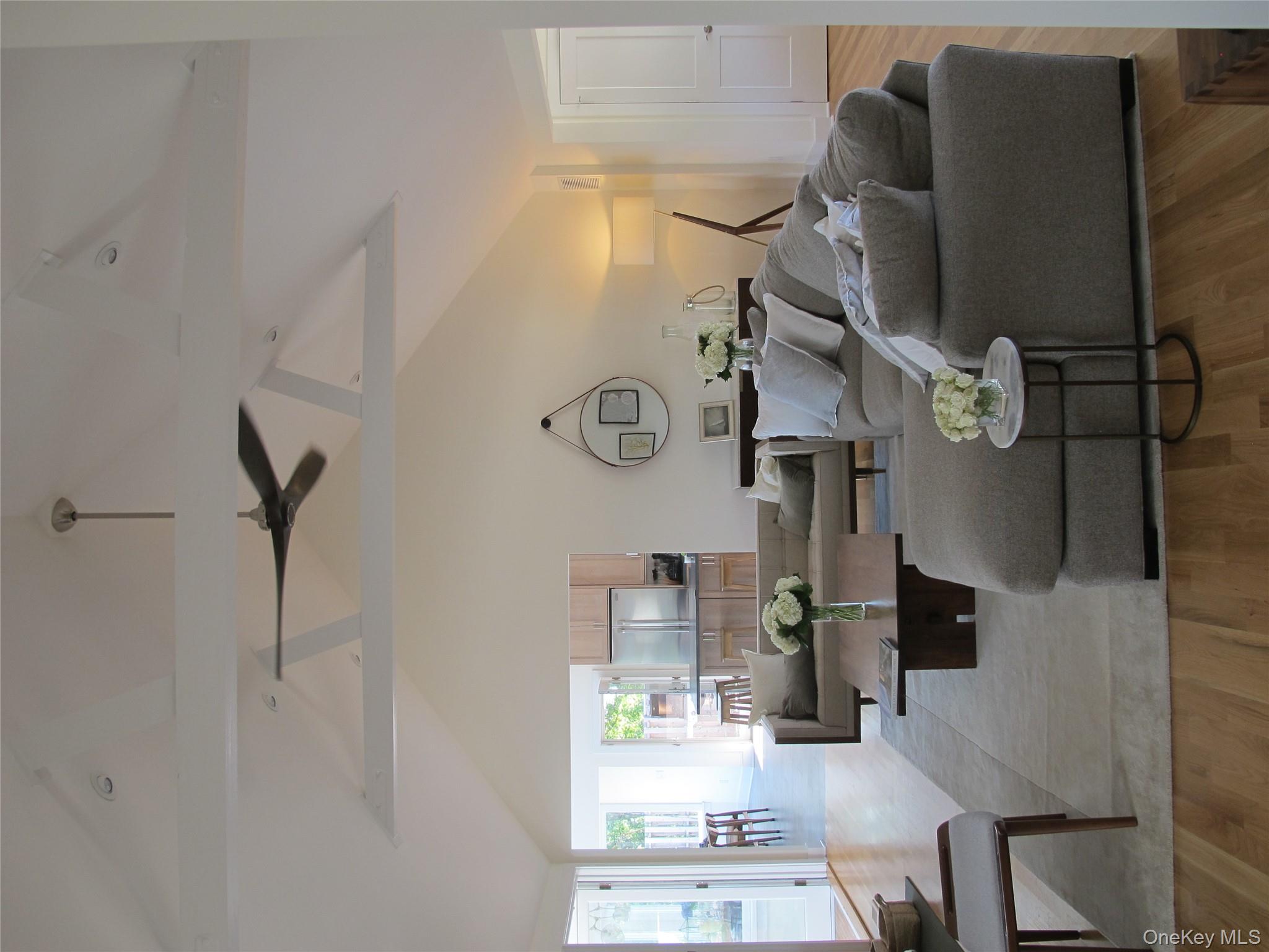 40 Tuthill Point Road East Moriches, NY 11940 - Photo 11 of 28 a living room with furniture and a large window