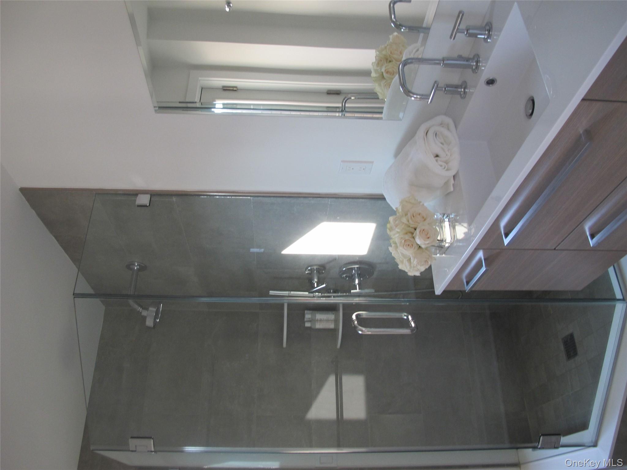 40 Tuthill Point Road East Moriches, NY 11940 - Photo 17 of 28 a bathroom with a sink shower and mirror