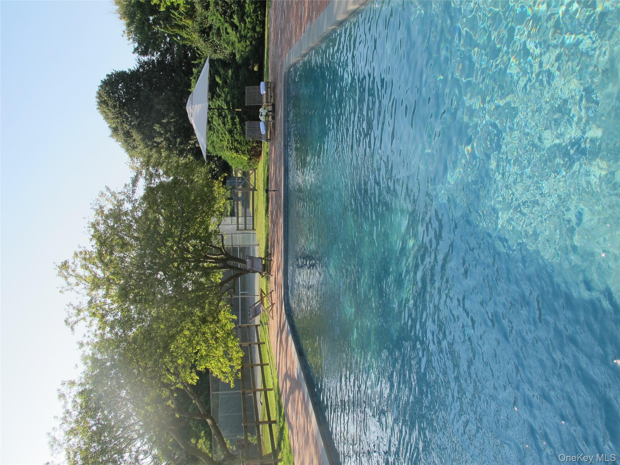 40 Tuthill Point Road East Moriches, NY 11940 - Photo 20 of 28 a view of a swimming pool and an outdoor space
