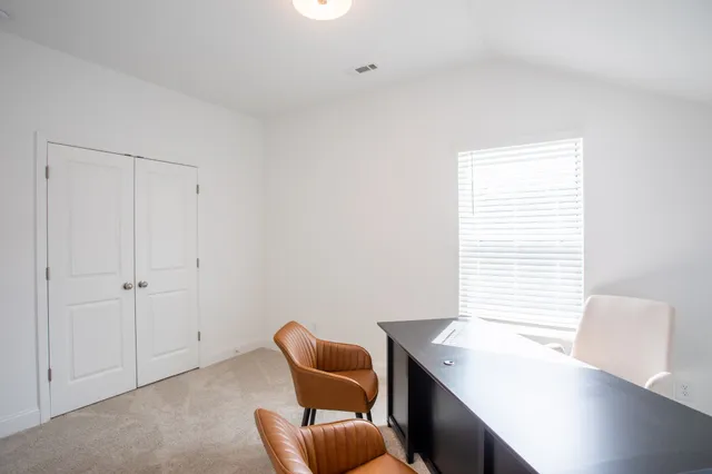 a room with furniture and a window