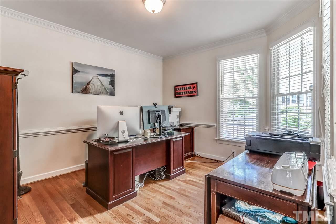 2416 Carruthers Court Raleigh, NC 27615 - Photo 8 of 26 a view of a workspace with furniture and a window