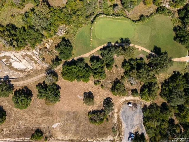 an aerial view of ocean with residential house with outdoor space