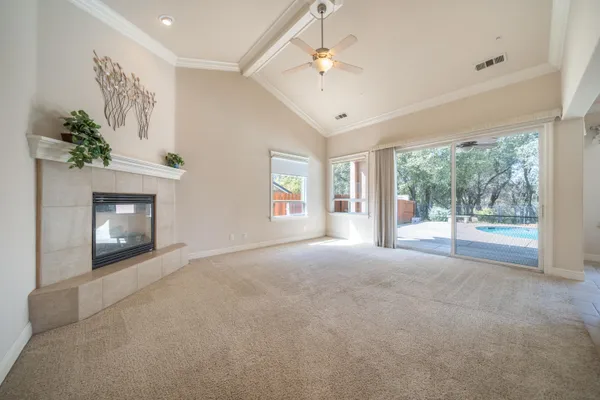 a view of a kitchen with a sink and a fireplace