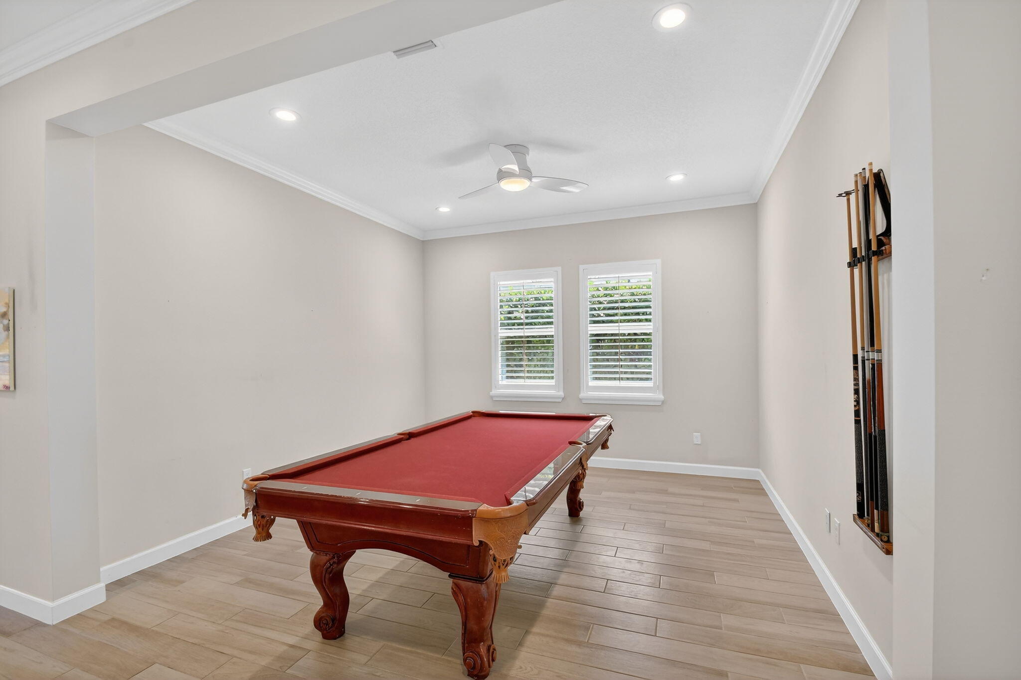 1055 Ember Ridge Run Loxahatchee, FL 33470 - Photo 11 of 103 a room with pool table and windows