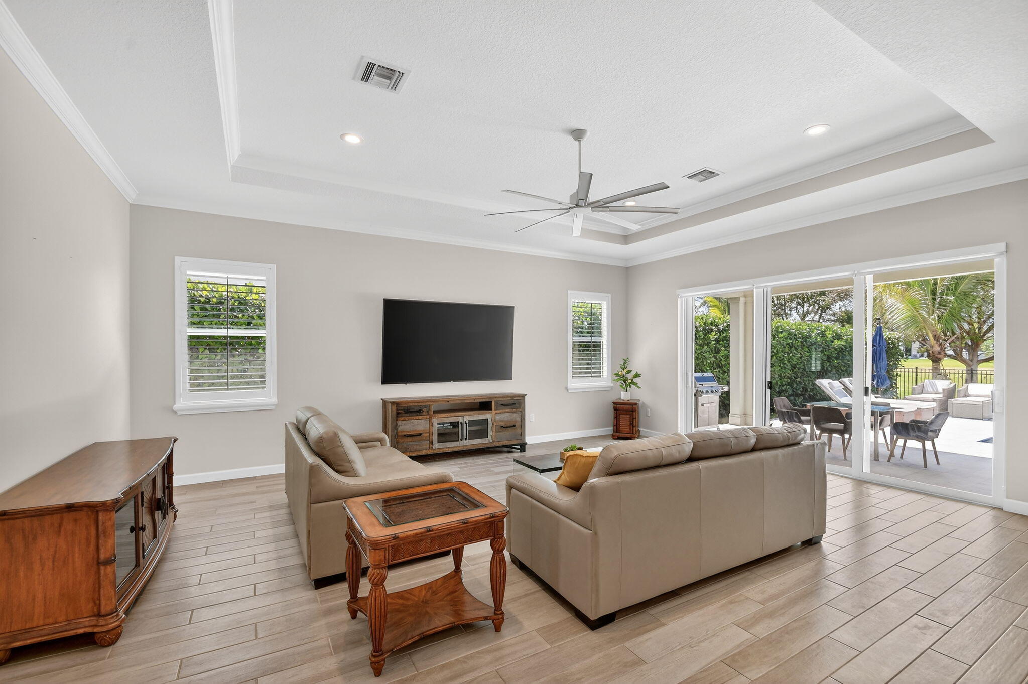 1055 Ember Ridge Run Loxahatchee, FL 33470 - Photo 14 of 103 a living room with furniture and a flat screen tv